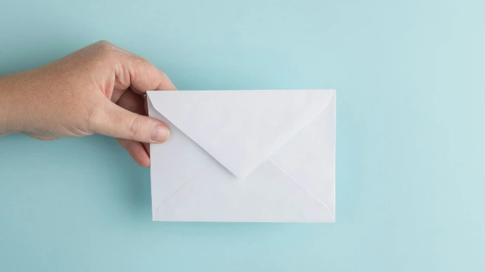 person showing white envelope